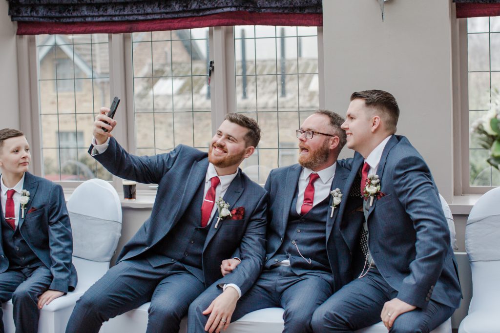 Groomsmen taking selfie