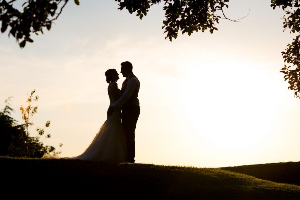 bride and groom at Sunset